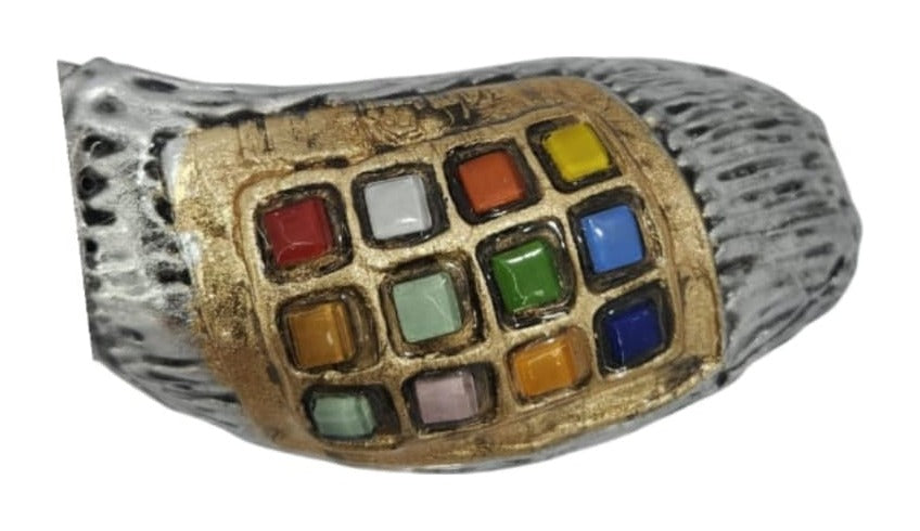 Close-up of the gold-tone plate with 12 colored stones in a grid on a silver-tone ram's horn shofar