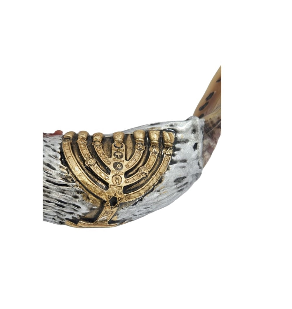 Close-up of the gold-tone menorah relief on a silver-tone ram's horn shofar